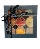 A Gift Box containing glace fruit with a ribbon around it.