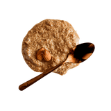 Dollop of Almond Butter with two whole almonds and copper teaspoon.