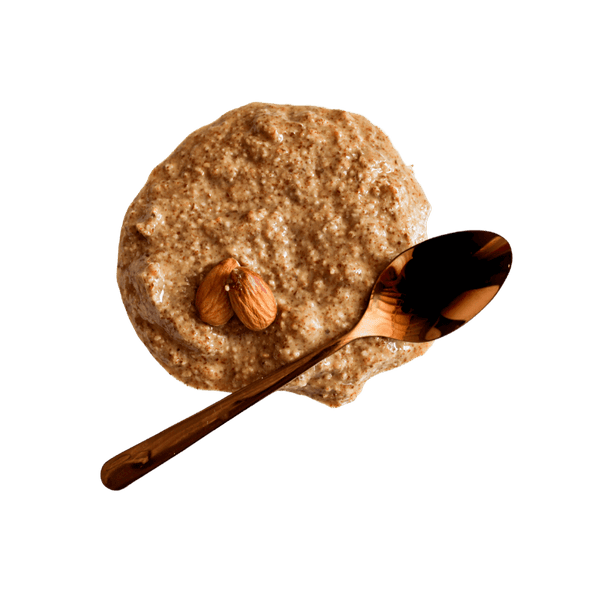 Dollop of Almond Butter with two whole almonds and copper teaspoon. 