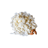 Neat pile of Blanched Almonds Flakes with three whole raw almonds.