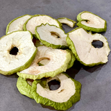 Close up of Dried Apple on concrete benchtop.