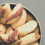 Close up of Brazil Nuts in round tin.