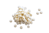 Small scattered pile of Callebaut White Chocolate Callets.