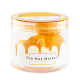 Side on view of Nut Market jar with Glace Peaches inside.
