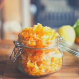 Close up of open preserving jar overflowing with Glace Mixed Peel.