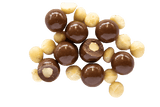 Milk Chocolate Macadamias and raw macadamias scattered.