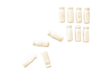 Two rows of Milk Bottle lollies. The bottom row has been scattered.