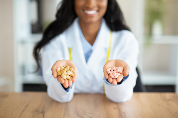 Dietician holding mood boosting nuts and medication