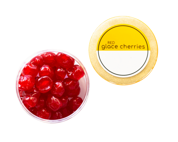 An open container of red glace cherries