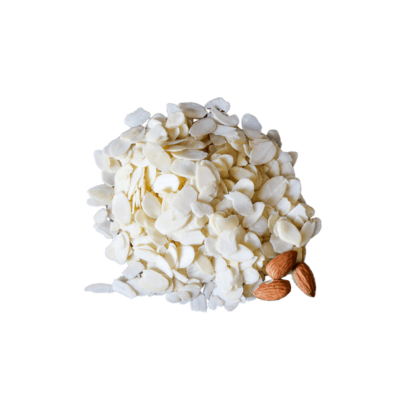 Neat pile of Blanched Almonds Flakes with three whole raw almonds. 