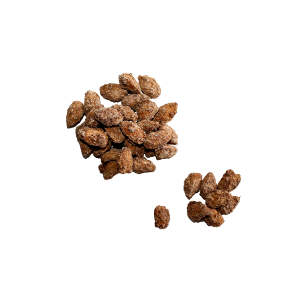 Scattered pile of Cinnamon Almonds. 