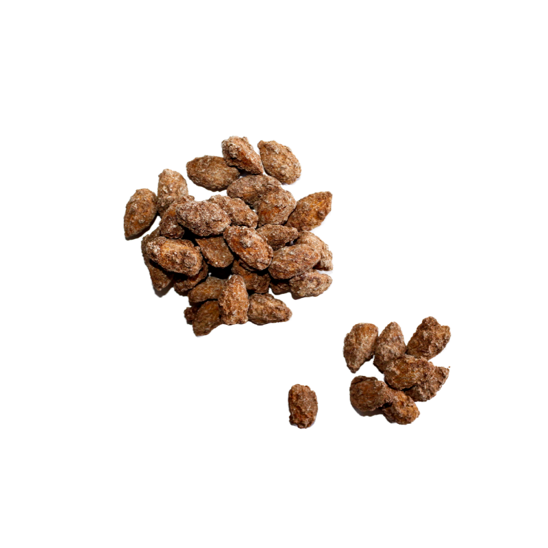 Scattered pile of Cinnamon Almonds. 