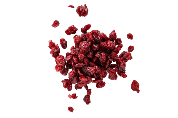 Close up of scattered pile of ruby red Dried Cranberries.