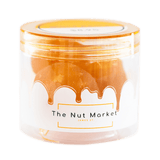 Side on view of Nut Market jar with Glace Apricots inside.