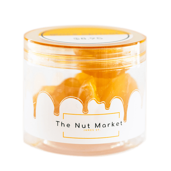 Side on view of Nut Market jar with Glace Peaches inside.