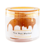 Side on view of Nut Market jar with Glace Pear inside.