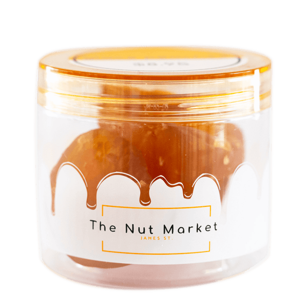 Side on view of Nut Market jar with Glace Pear inside.
