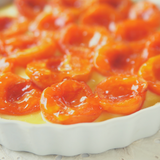 Close up of Glace Apricot on top of baked tart. 