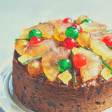 Fruit Cake/ Christmas Cake decorated with Glace Pineapple and Glace Cherries. 