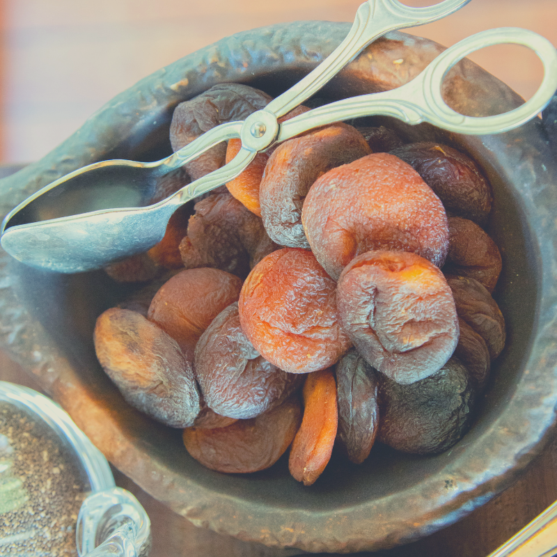 Organic Apricots in timber bowl.