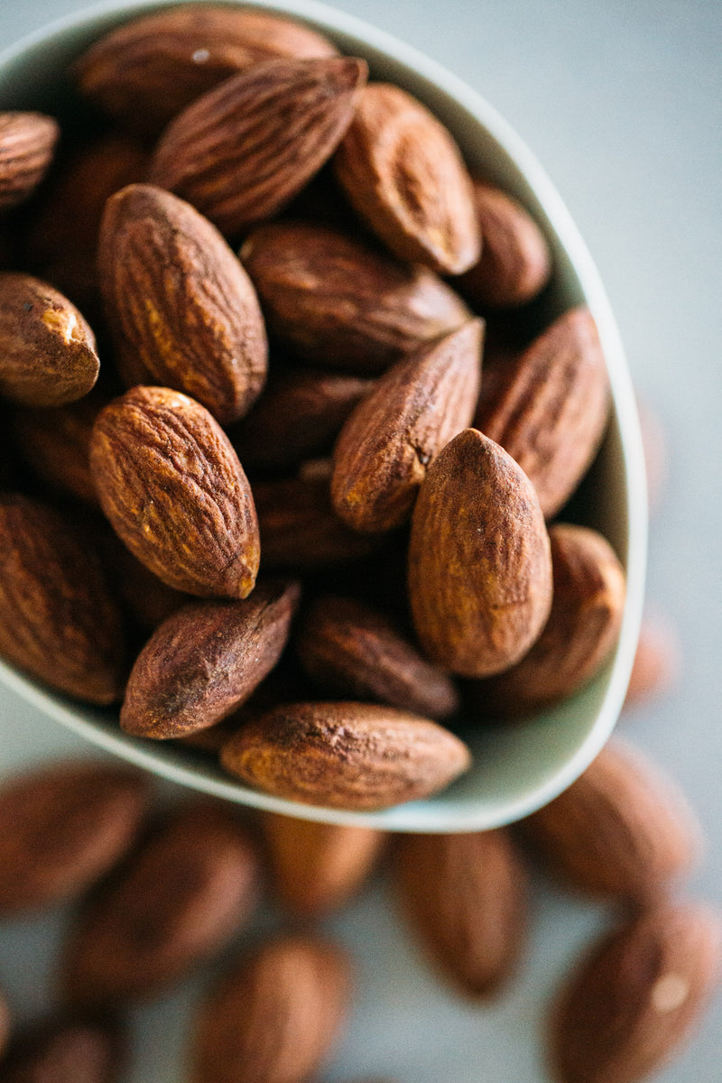 Close up of Dry Roasted Almonds in small bowl.