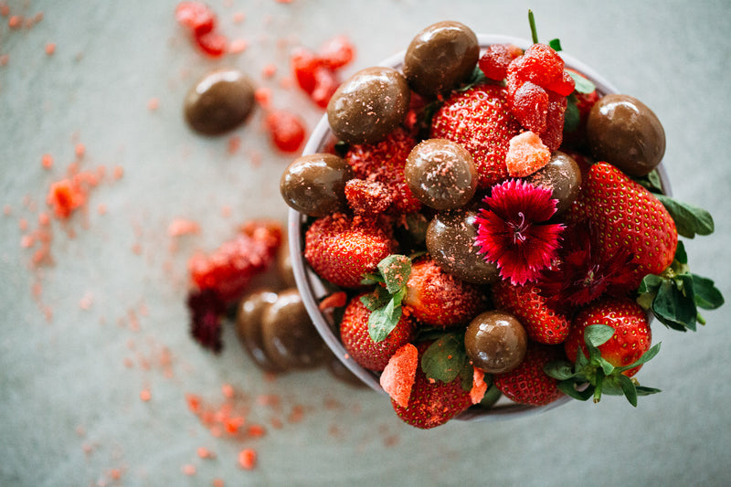 Dark Chocolate Strawberries in bowl with fresh strawberries.